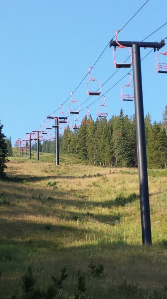 The wild ski lift in its natural habitat, calm for now, but voracious in its yearly hunger for skiers, always going back for more.